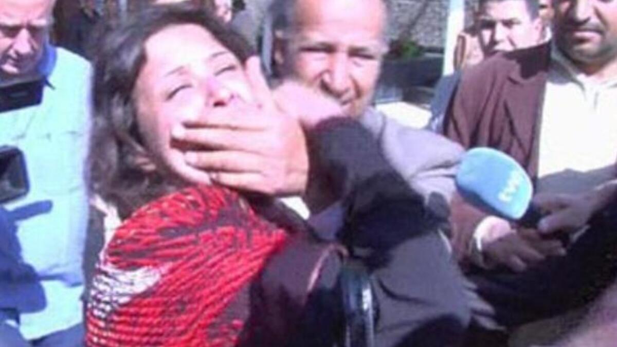 She was manhandled by government minders who attempted to clamp her mouth shut by their hands, But she did not want to go quietly.