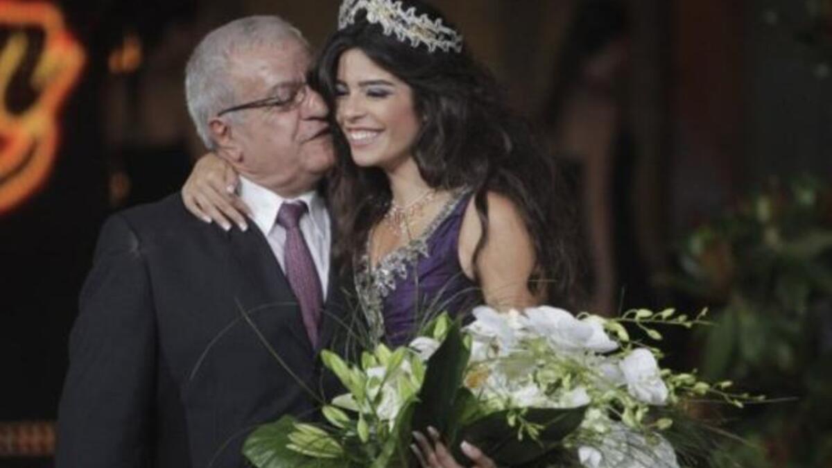 Yara Khoury Mikael is congratulated by her father after winning the Miss Lebanon 2011 beauty contest.