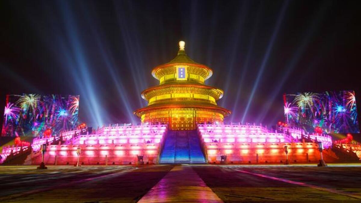 The Temple of Heaven (The Qi Nian Temple) is illuminated as Beijing celebrates the New Year's Eve at the Temple of Heaven Park in Beijing, China.