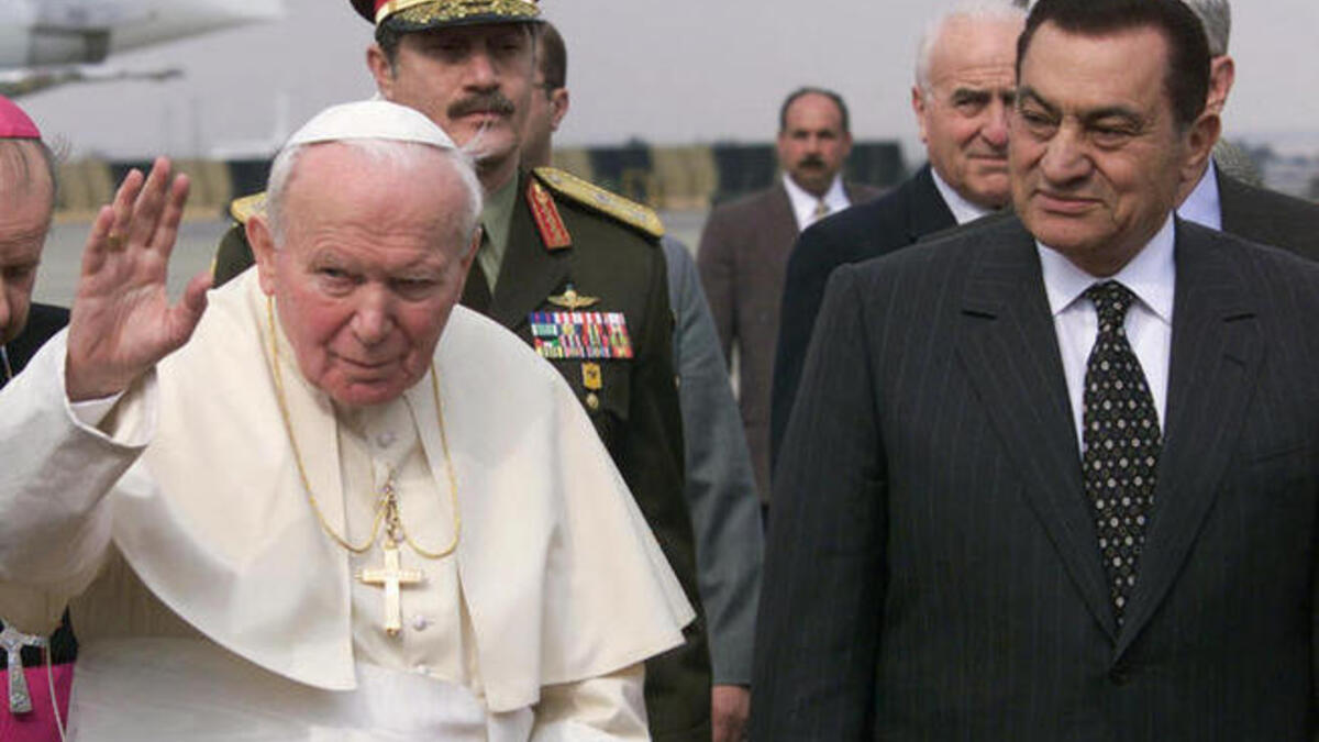 Pope John Paul II poses with then President Mubarak on his Egypt tour
