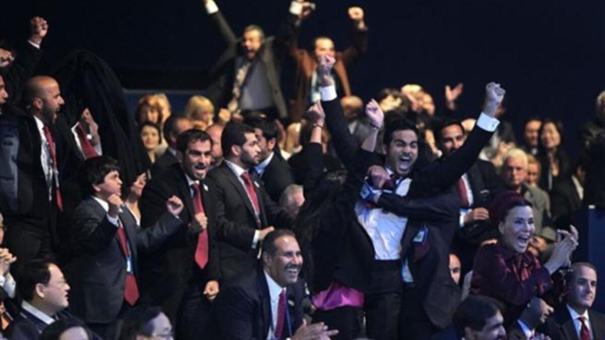 Members of the Qatari delegation celebrate following the official announcement of the 2022 World Cup host country at the FIFA headquarters in Zurich.