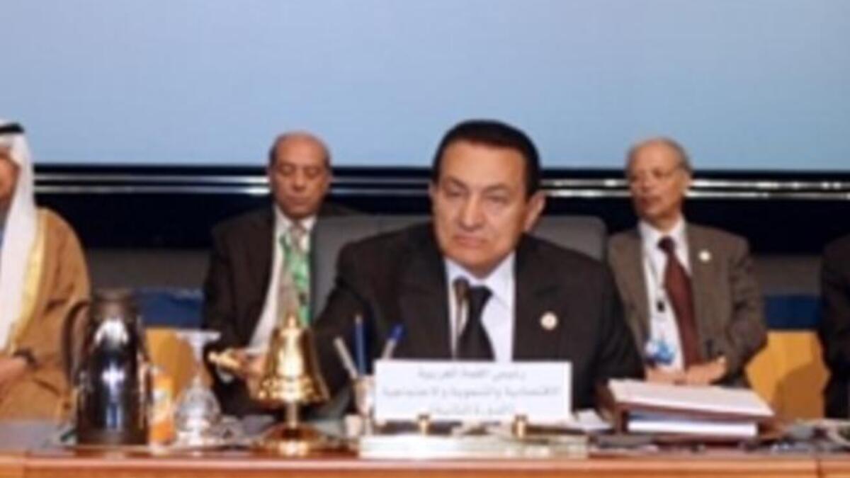 Egyptian President Hosni Mubarak chairs the opening session of the second Arab Economic Summit, with Kuwait's emir Sheikh Sabah al-Ahmad al-Sabah and Arab League Secretary General Amr Mussa.