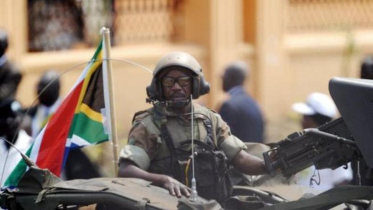 A South African soldier rides a commando truck as they follow the South Africa's President Jacob Zuma's arrival to the ceremony in the capital Juba.