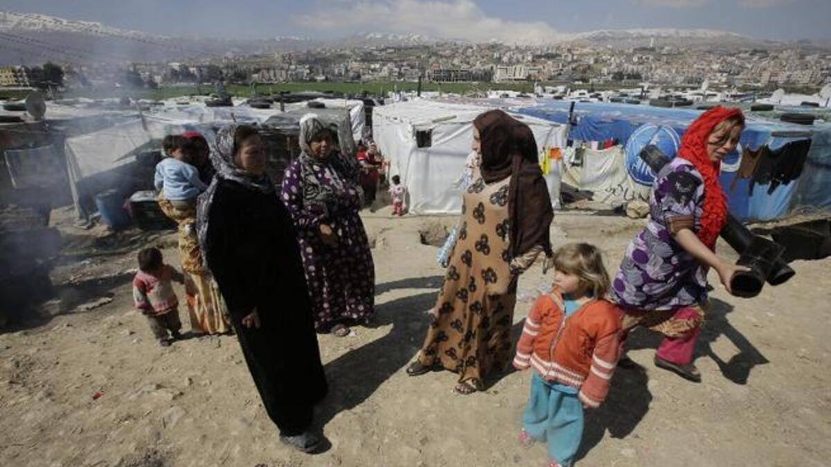 Women at a makeshift camp in Lebanon