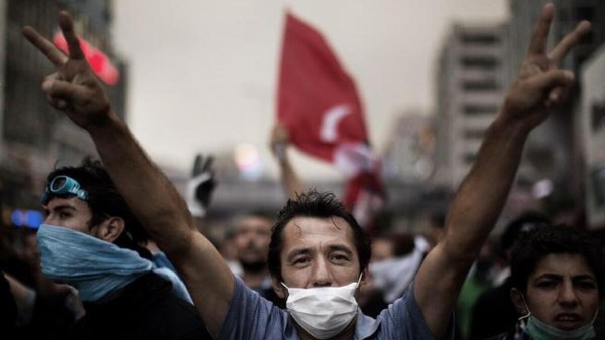 Face-mask, double victory sign, this Ankara demonstrator knows exactly how to do it. Huge rallies were held after the government apologised to wounded protesters and said it had ‘learnt its lesson’
