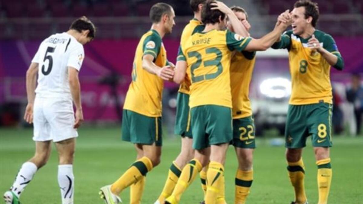 QATAR: Australia's players celebrate after midfielder Brett Emerton scored his team's fourth goal against Uzbekistan during their 2011 Asian Cup semi-final football match, January 25, 2011.