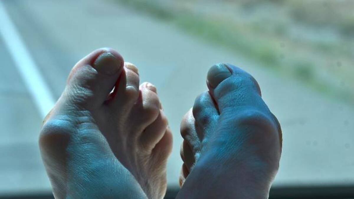 Raising feet on taxi dashboard
