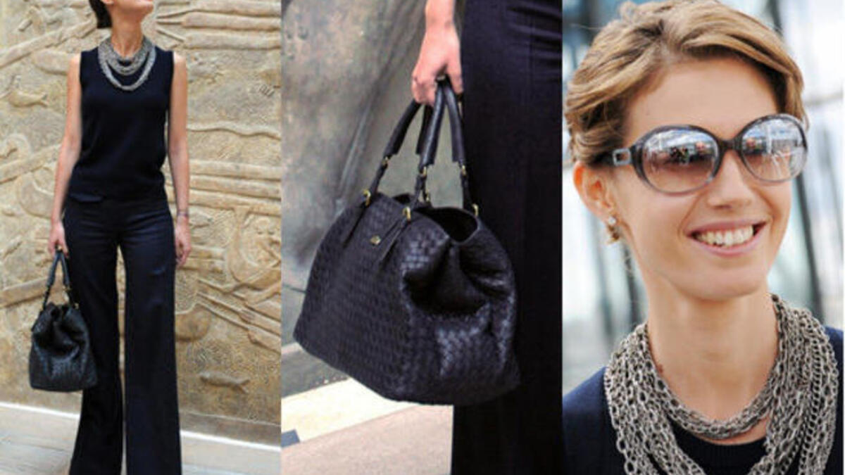 Asma Al Assad shows off her handbags.