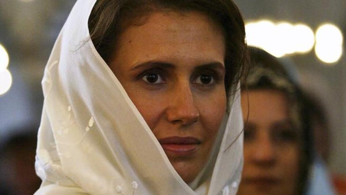 Asma Al Assad dons a veil.