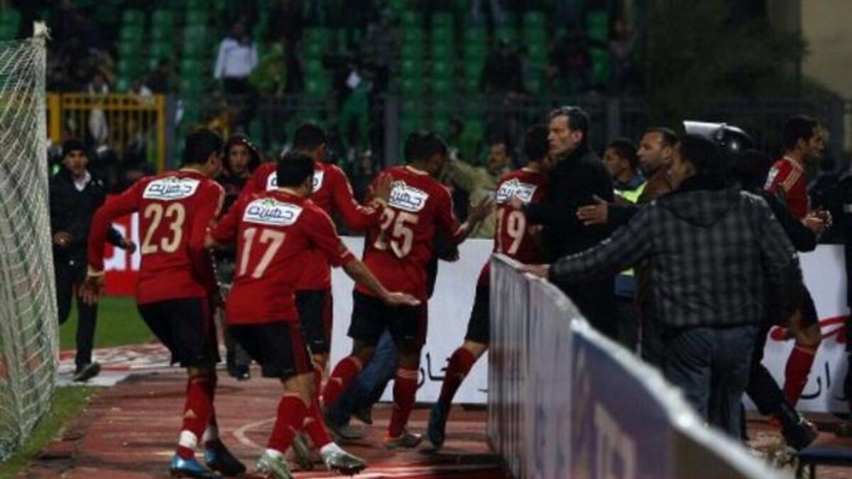 Al-Ahly players abandon the pitch as Al-Masry fans rush to the locker-room. The 'big team'
face-off with a local home team, underdog, victor-  Al Masry - got ugly when hardcore 'groupies' in Egypt known as 'Ultras' kicked off. These fanatic followers of fanclubs, introduced grievances from Tahrir, Masepro,& propaganda into friendly football.