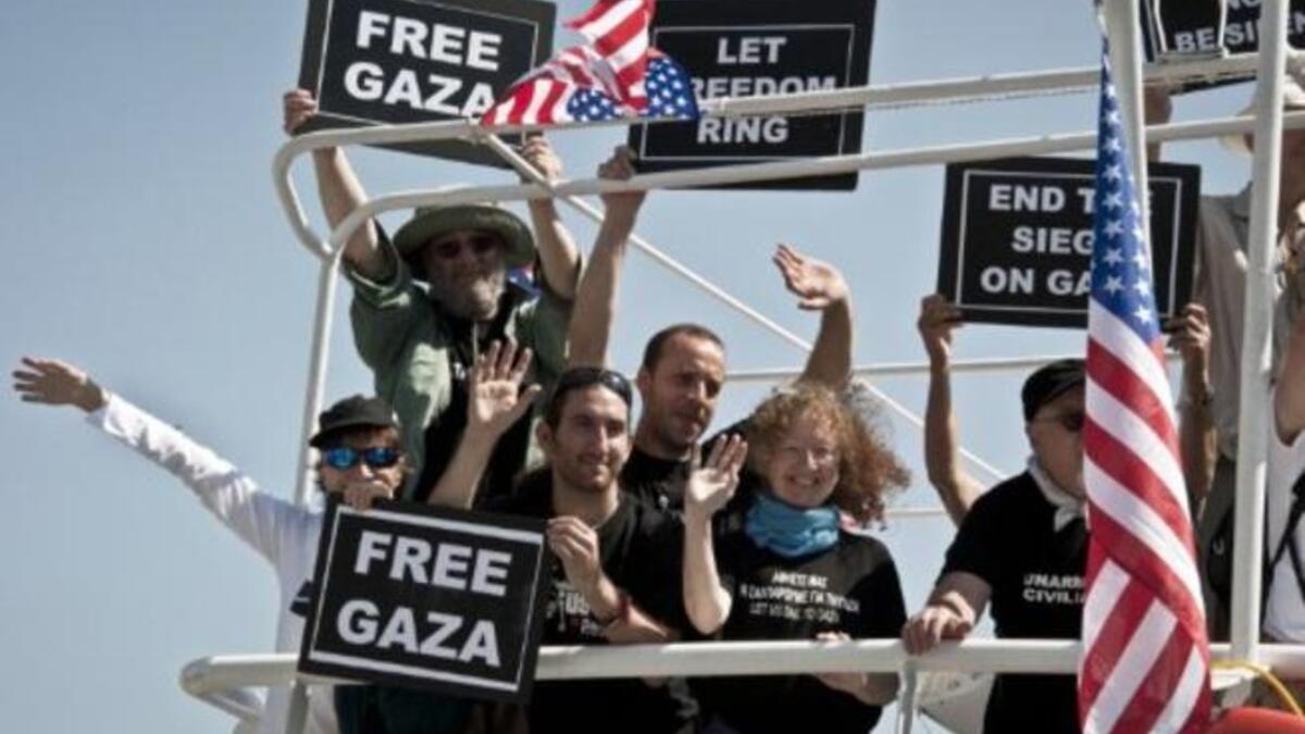 Still smiling, activists after 8/10 boats intercepted 2 weeks on from the sunny start. 2 remaining boats of aspiring
sea-farers, French ship the 'Dignity El Karameh' and the Swedish-Norwegian-Greek 'Juliano' still struggle, docked in the
Greek grip.