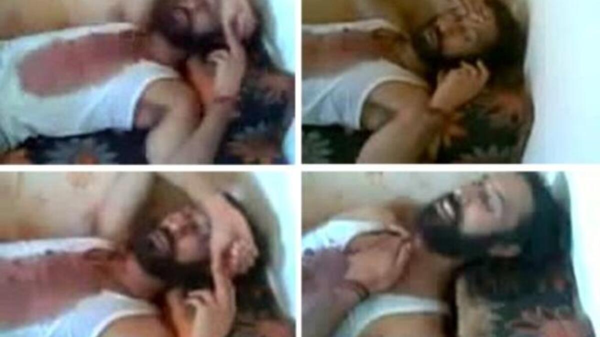 A collage of shots from a video taken from the mobile phone of a NTC fighter shows Mutassem Gaddafi, son of Libya'sfallen leader Muammar Gaddafi, lying on a sofa after his capture and before his death in Sirte on October 20. He was captured alive and last seen smoking a cigarette and finally lying down on a sofa, blood stained but quite alive.