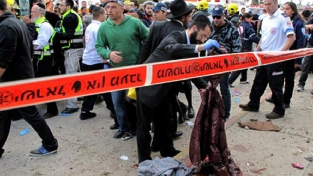 Israeli paramedics and emergency services rush to the scene of a massive bus explosion.