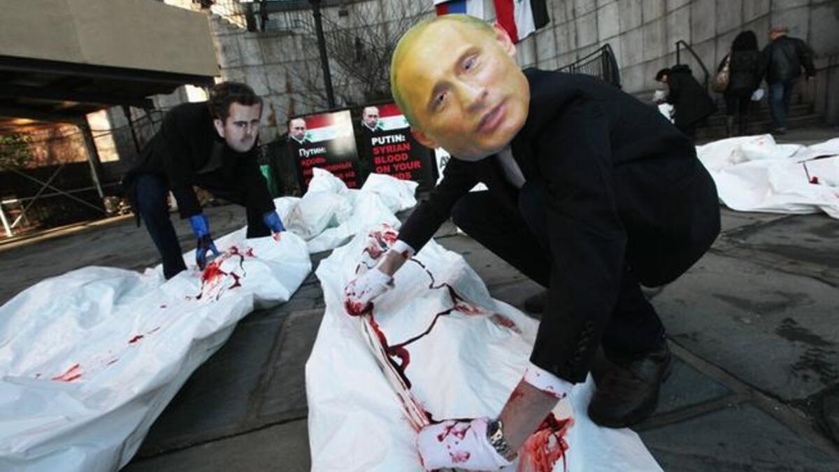 Syria protests with doctored pictures of Putin killing people
