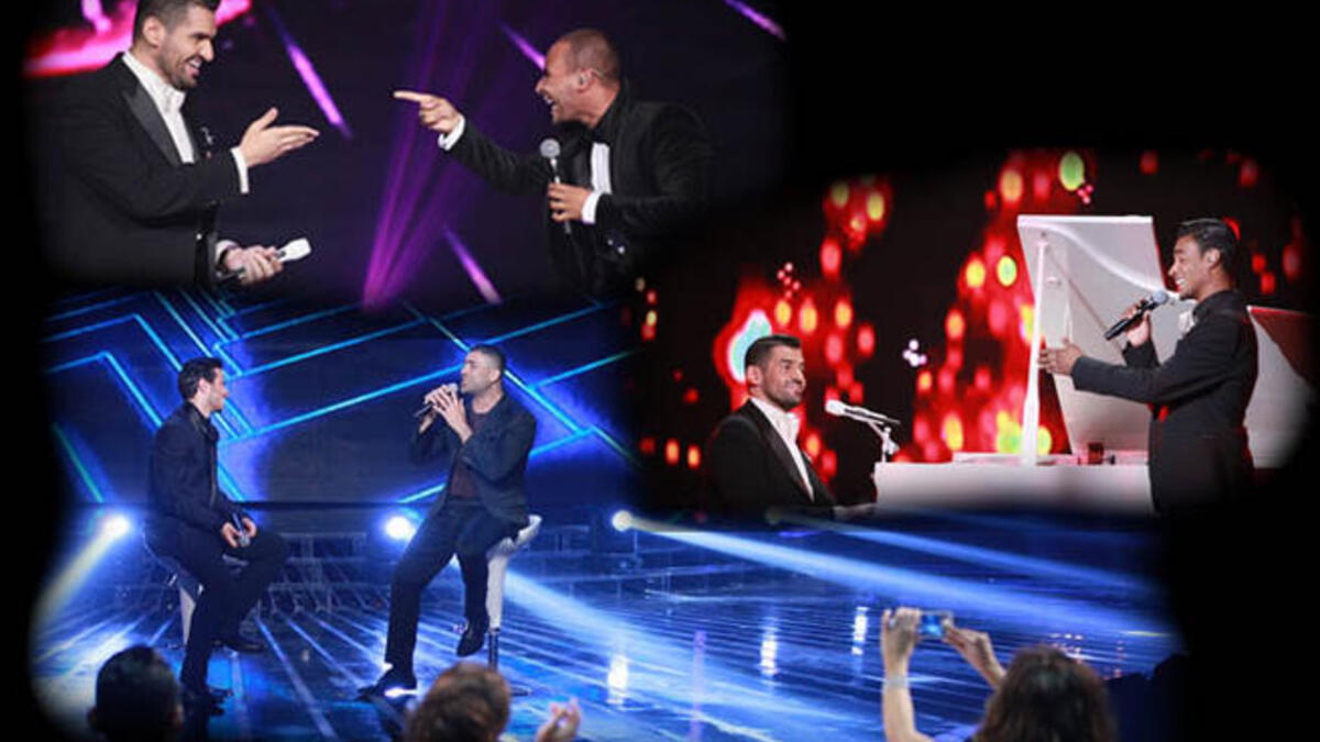 المتسابقين يقدمون ديو مع مدربيهم