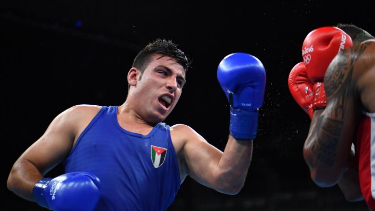 Jordan's Hussein Iashaish fights France's Tony Victor James Yoka during the Men's Super Heavy (+91kg) Quarterfinal 1 match at the Rio 2016 Olympic Games at the Riocentro - Pavilion 6 in Rio de Janeiro on August 16, 2016.
Yuri CORTEZ / AFP