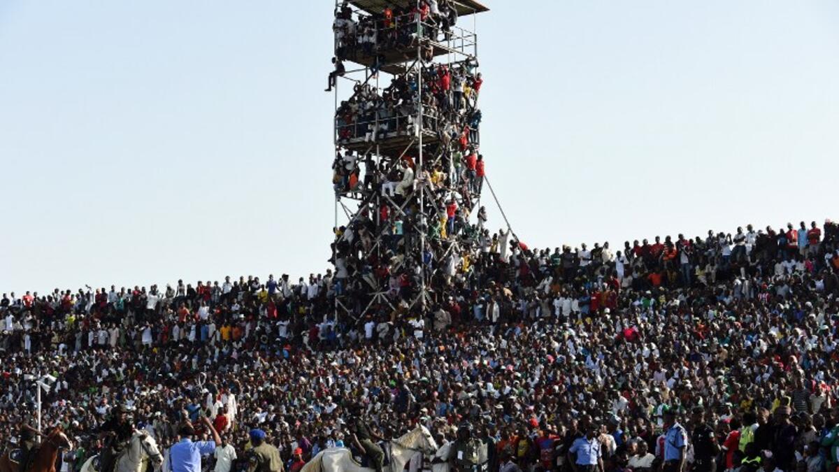 Supporters attend the African Cup of Nations qualification match between Egypt and Nigeria, on March 25, 2016, in Kaduna.
PIUS UTOMI EKPEI / AFP