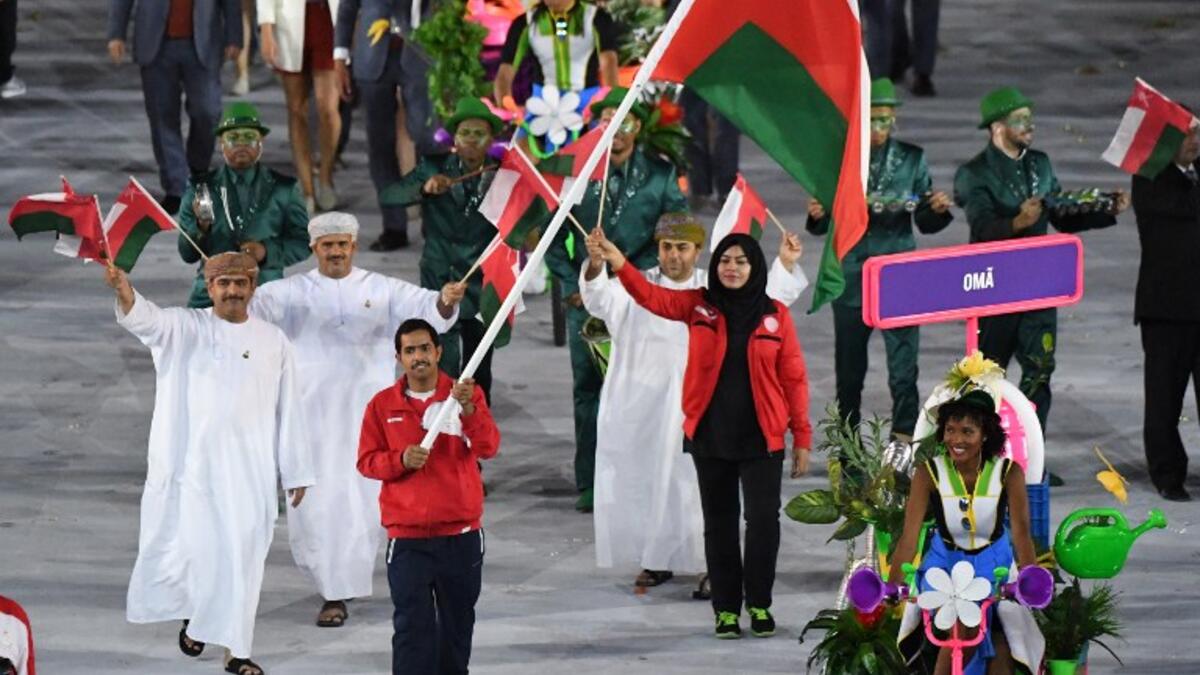 Oman's flagbearer Hamed al-Khatri leads his delegation during the opening ceremony of the Rio 2016 Olympic Games at the Maracana stadium in Rio de Janeiro on August 5, 2016. PEDRO UGARTE / AFP