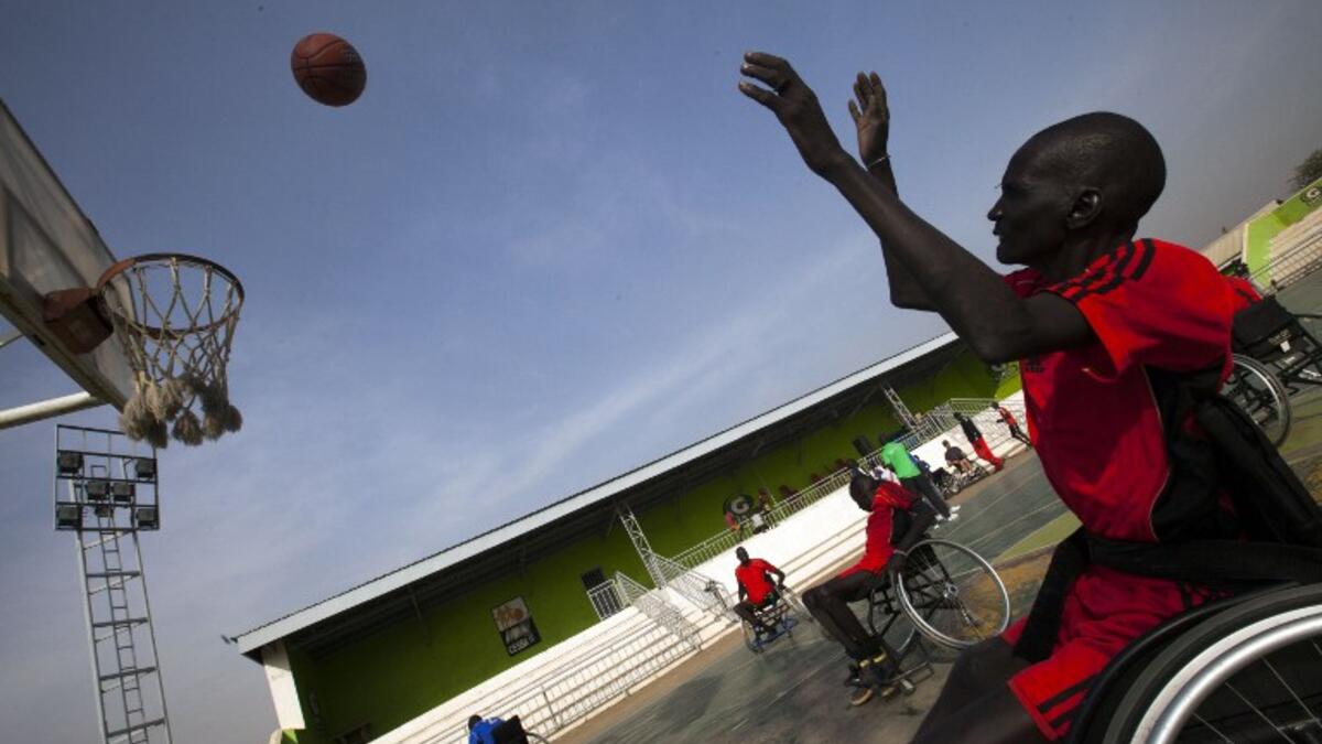 A South Sudanese basketball wheelchair player train at the Juba Basketball Court on January 11, 2017, during a training session by the US Wheelchair Basketball coach. Invited by the International Committee of the Red Cross (ICRC), Jess Markt.
ALBERT GONZALEZ FARRAN / AFP
