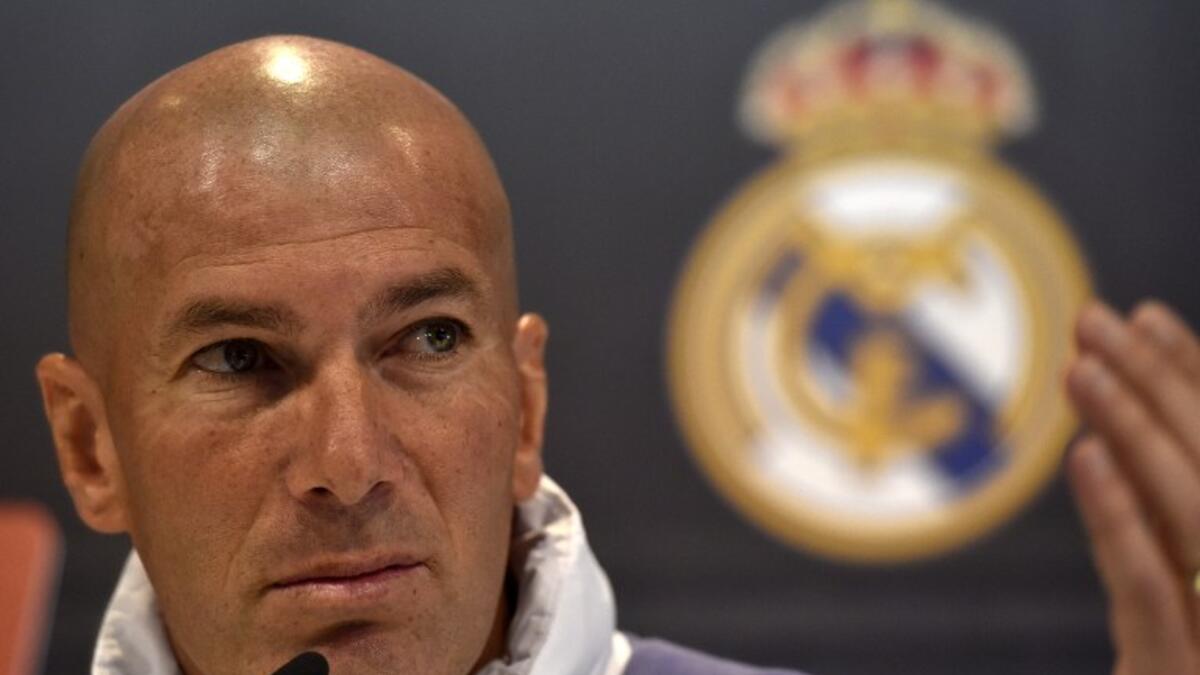 Real Madrid's French coach Zinedine Zidane gestures during a press conference at Valdebebas training ground in Madrid on April 22, 2017, on the eve of the Spanish League Clasico football match Real Madrid CF vs FC Barcelona.
GERARD JULIEN / AFP