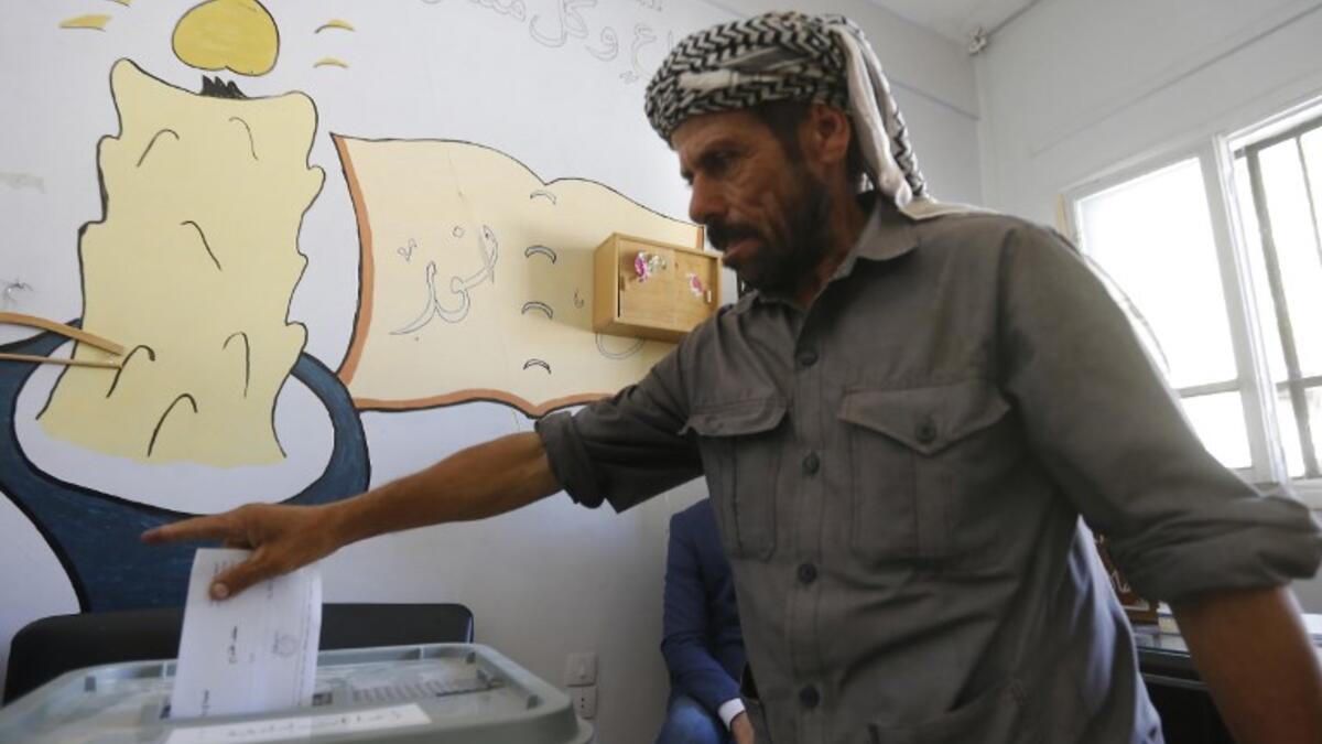A man casts his ballot for Syria's first local elections since 2011, on September 16, 2018 in the southern Eastern Ghouta, on the eastern outskirts of the capital Damascus. (LOUAI BESHARA / AFP)