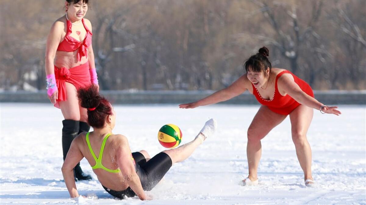 Shenyang, China: Women play in the snow in China's northeastern Liaoning province in celebration of Women's day. (AFP)