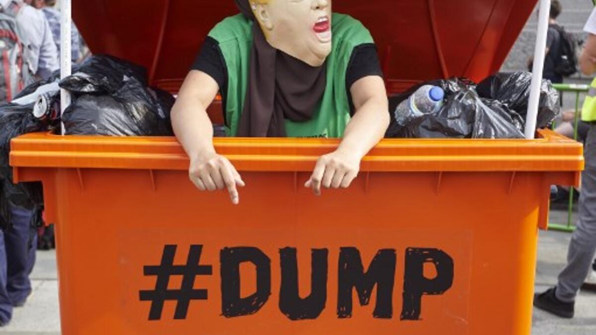 Protesters against the UK visit of US President Donald Trump gather in Trafalgar Square after taking part in a march in London on July 13, 2018. (Niklas HALLEN / AFP)