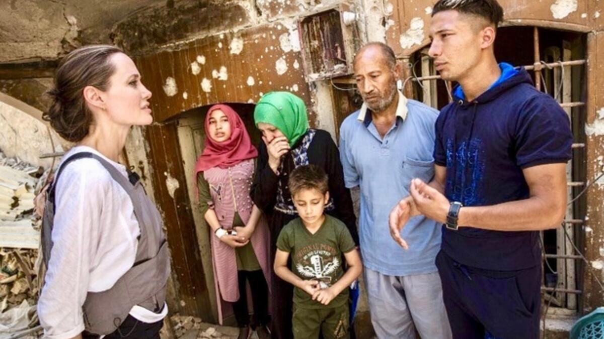 Angelina Jolie meeting with Mohamed and his family during a visit to the Old City in the west of the northern Iraqi city of Mosul, June 16, 2018. (AFP/ File)