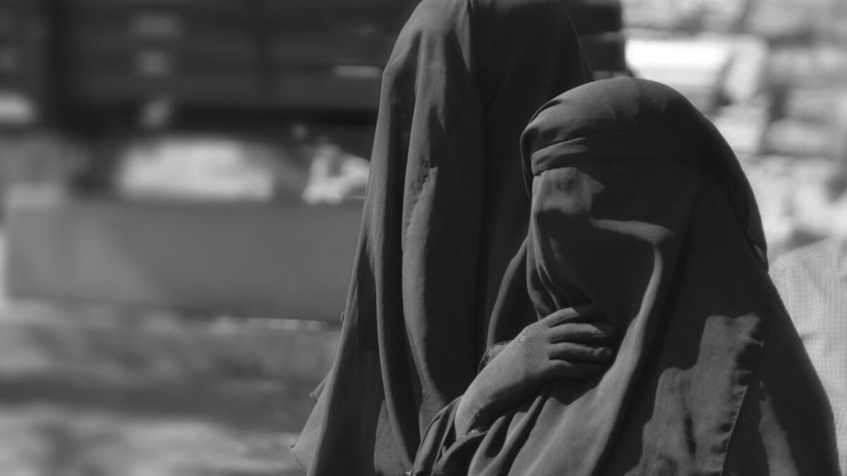 Daesh (ISIS) issued a fatwa banning women from appearing in public during fasting hours to avoid vice. The fatwa also bans women from appearing in public after fasting hours unless she is accompanied with one of her male family members. (Shutterstock)