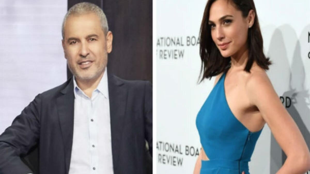 أثار ظهور الممثلة الاسرائيلية "جال جادوت" بفستان من تصميم المصمم الازياء العالمي ايلي صعب بحفل "national board of review "awards حالة من الاستنكار عبر مواقع التواصل الاجتماعي متهمين المصمم اللبناني بـ"التطبيع".