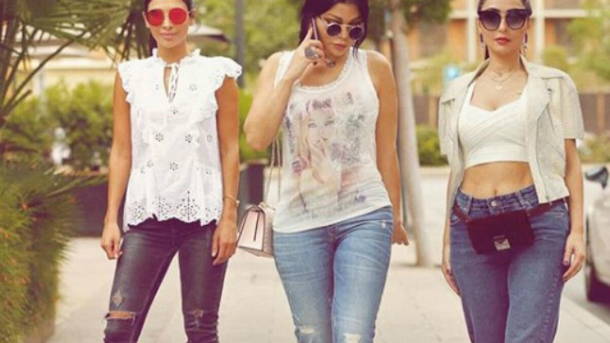 The Lebanese diva and her sisters sported casual looks with denim tight pants