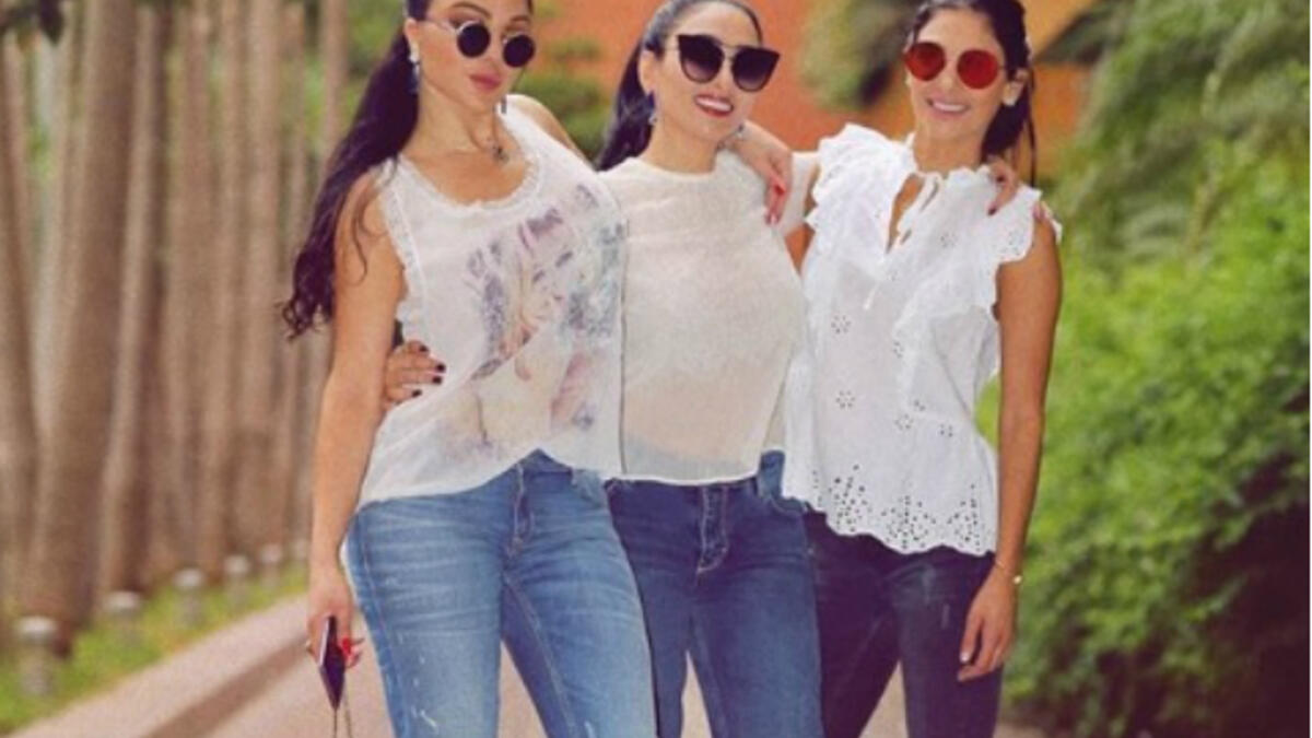 The Lebanese diva and her sisters sported casual looks with denim tight pants