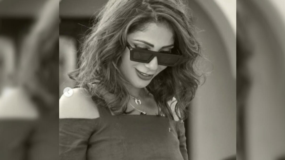 She added a thick bracelet, sunglasses and high heeled sandals as accessories