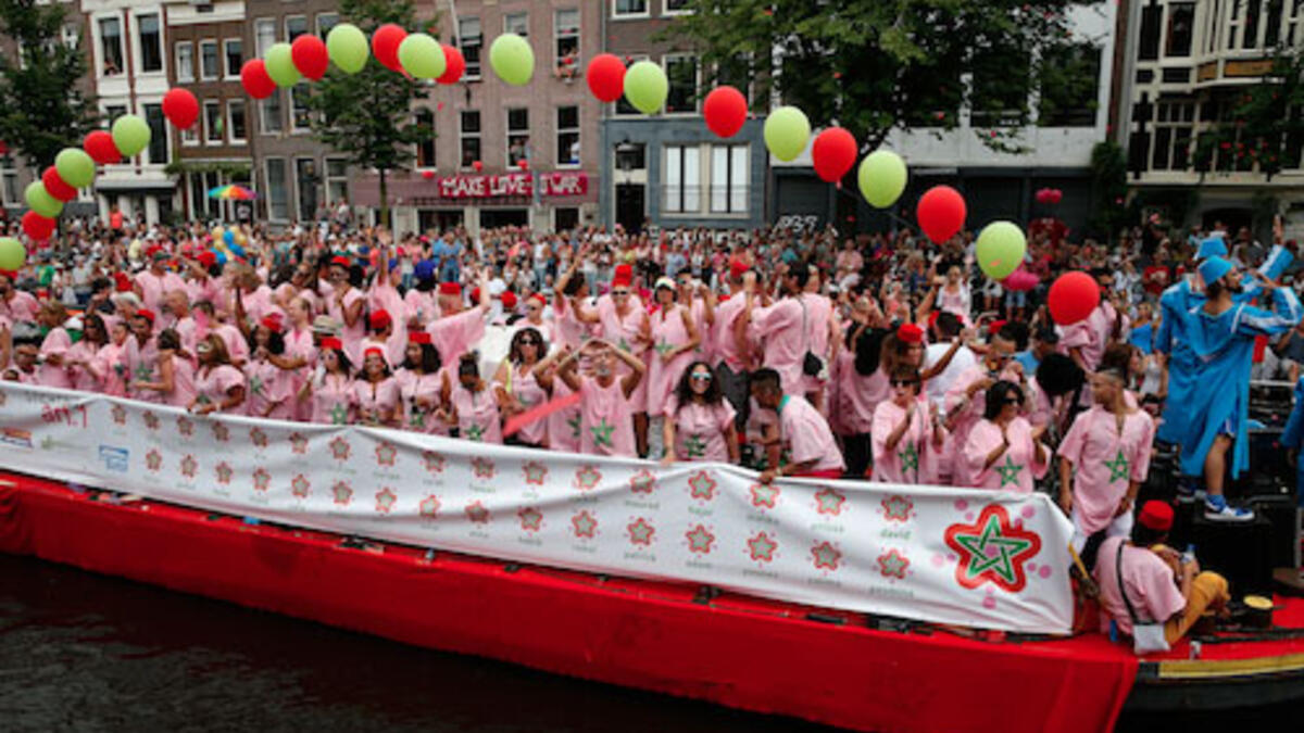 Moroccan presence in Paris’ Gay Pride parade shows support for same-sex rights, despite current laws in Morocco. Travelers say the Muslim yet liberal nation provides a friendly environment for those who identify as LGBT. Moroccans and Jews, also attended Amsterdam’s annual Pride Canal Parade for the first time last year. (AFP/Bas Czerwinski)