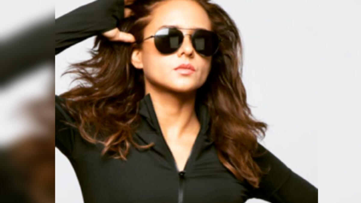 She can really pull off the shades police officer look