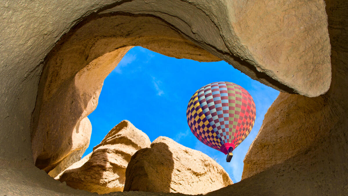 Hot air balloons over mountain landscape in Cappadocia, Goreme National Park, Turkey (Shutterstock/File Photo)