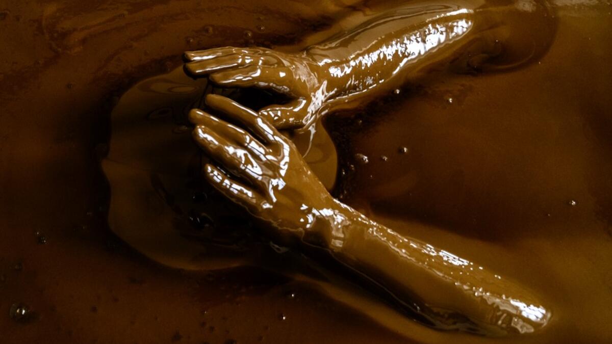 A man bathes in a tub filled with Naftalan crude oil during a treatment session at Sehirli Naftalan Health Center, some 300 kilometres (186 miles) from capital Baku, on March 21, 2019. Immersed up to her neck in crude oil, a Russian woman suffering from joint disease smiles in delight, confident that the treatment at a spa in northwestern Azerbaijan will cure her painful condition.  Mladen ANTONOV / AFP
