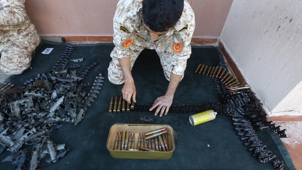 Fighters from a Misrata armed group loyal to the internationally recognised Libyan GNA prepare their ammunition before heading to the frontline as battles against Forces of Libyan strongman Khalifa Haftar continue on the outskirts of the capital Tripoli on April 9, 2019. Mahmud TURKIA / AFP
