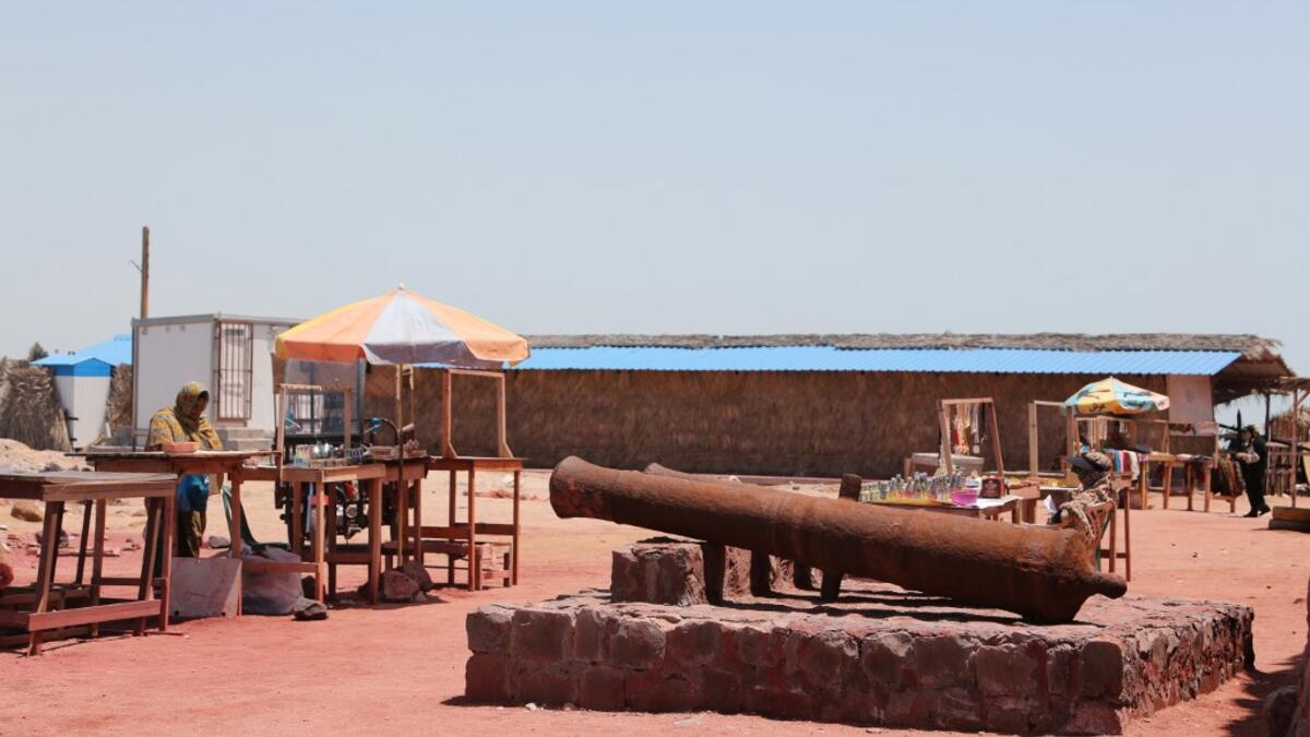 People vist the Fort of Our Lady of the Conception, also known as the Portuguese Castle, the Hormuz Island in the Gulf Strait of Hormuz, off the Iranian port city of Bandar Abbas, on April 29, 2019.  ATTA KENARE / AFP