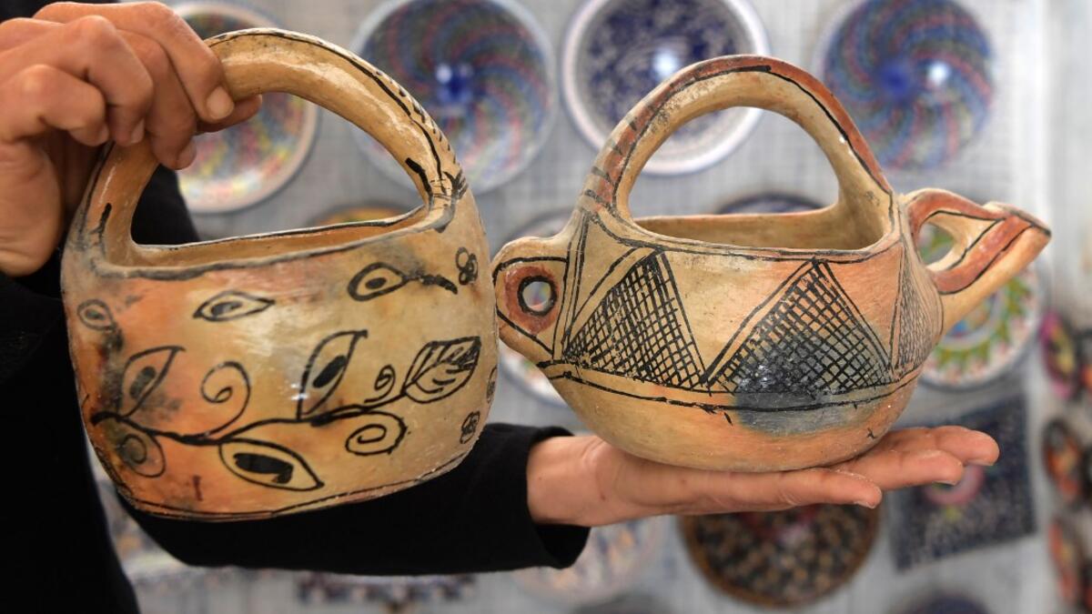 Pottery crafted in Sejnane is displayed at a souvenir shop in the Tunisian capital Tunis. FETHI BELAID / AFP