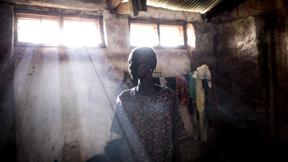 Elizabeth, a South Sudanese Refugee, poses inside a refugee transition camp in Aru for South Sudanese who have just arrived in the Democratic Republic of the Congo.  JOHN WESSELS / AFP