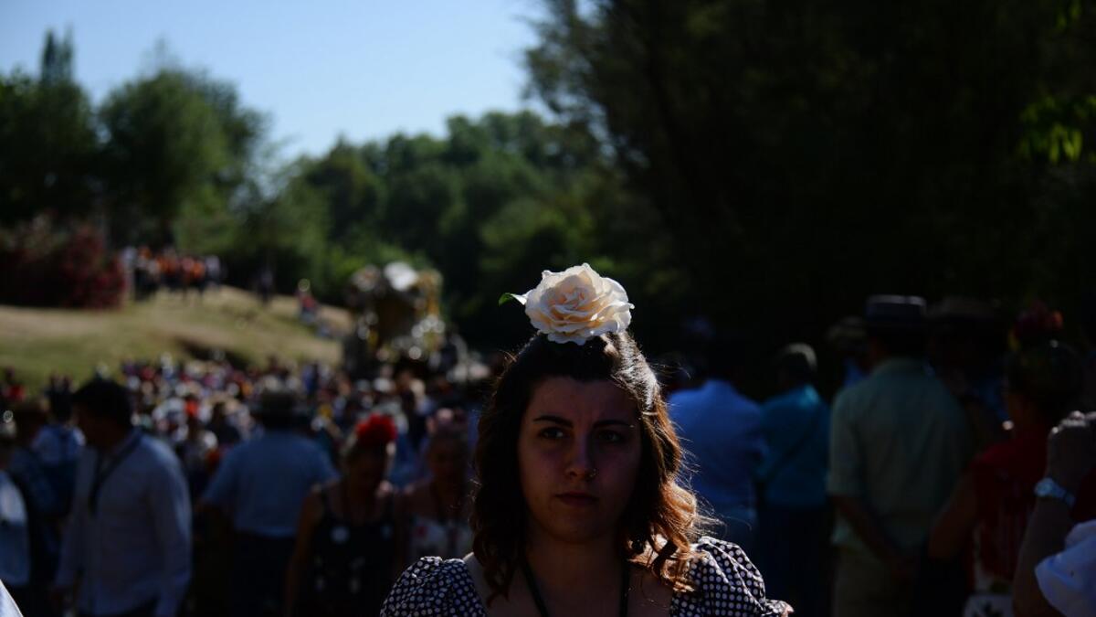 Pilgrims cross the Quema river in Villamanrique, during a pilgrimage to the village of El Rocio.  CRISTINA QUICLER / AFP