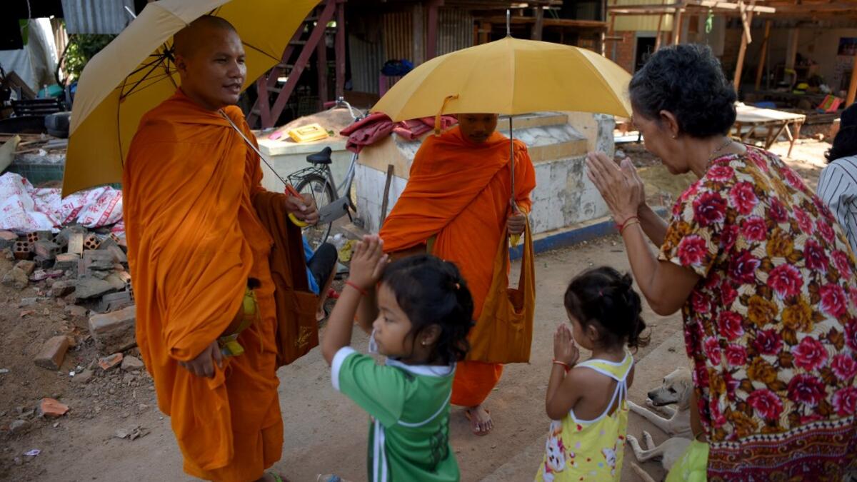 Graveyards may traditionally be the eternal resting place for the dead, but one cemetery in Phnom Penh is increasingly becoming a place to stay for the living as land disputes plague the nation’s poor.  TANG CHHIN Sothy / AFP