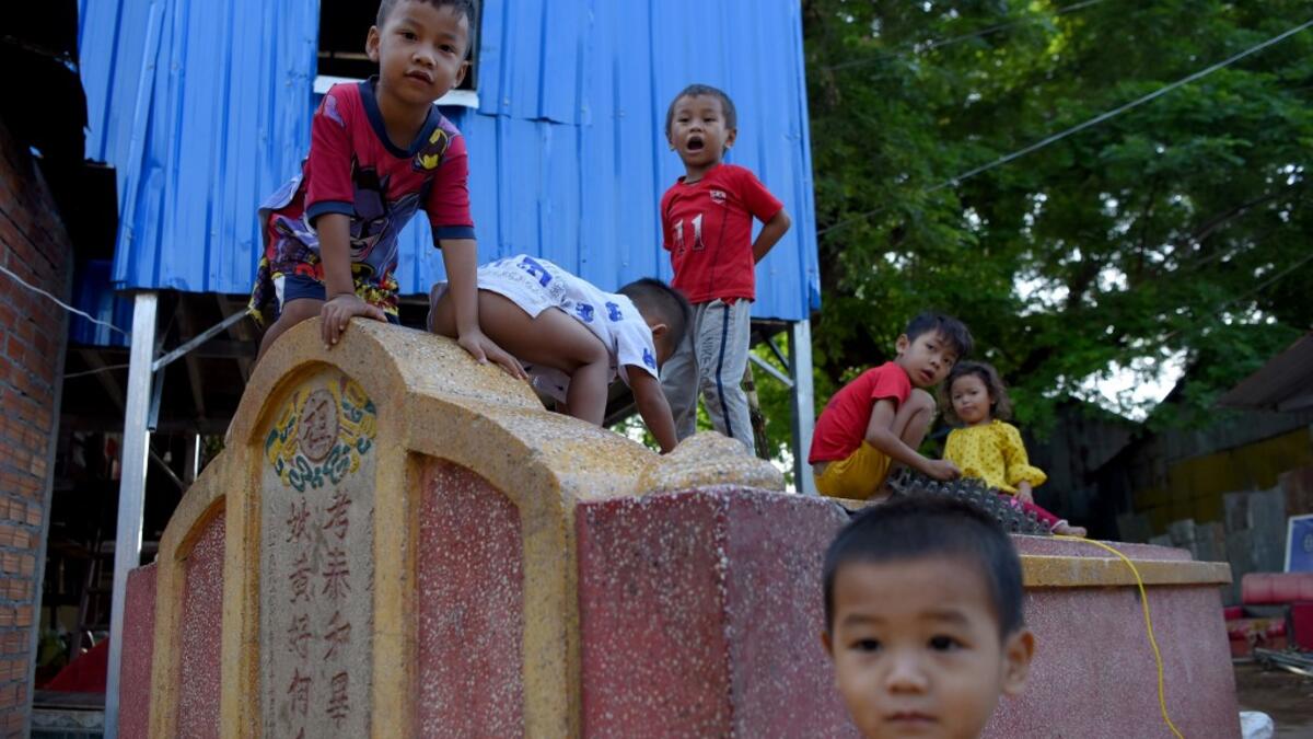 Graveyards may traditionally be the eternal resting place for the dead, but one cemetery in Phnom Penh is increasingly becoming a place to stay for the living as land disputes plague the nation’s poor.  TANG CHHIN Sothy / AFP