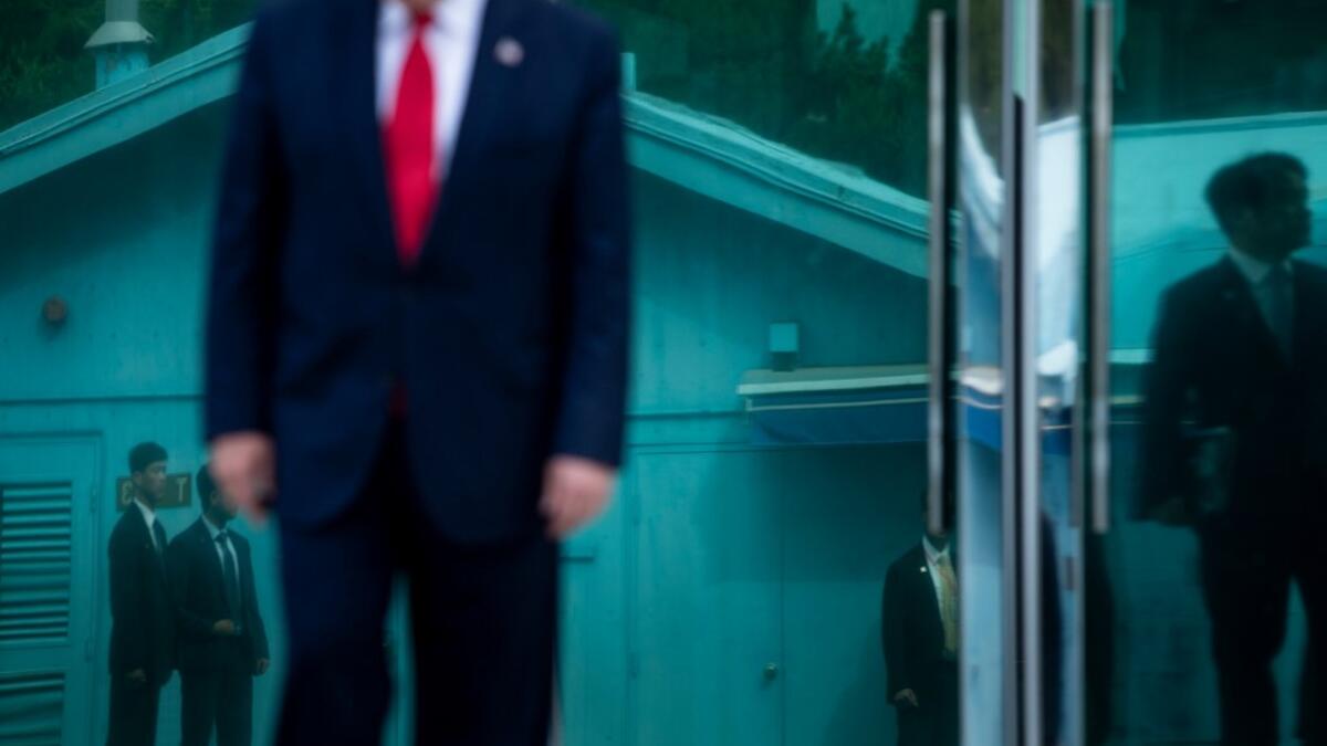 US President Donald Trump leave Freedom House before walking to the line of demarcation to meet North Korea's leader Kim Jong-un in the Demilitarized Zone(DMZ) on June 30, 2019, in Panmunjom, Korea.  Brendan Smialowski / AFP