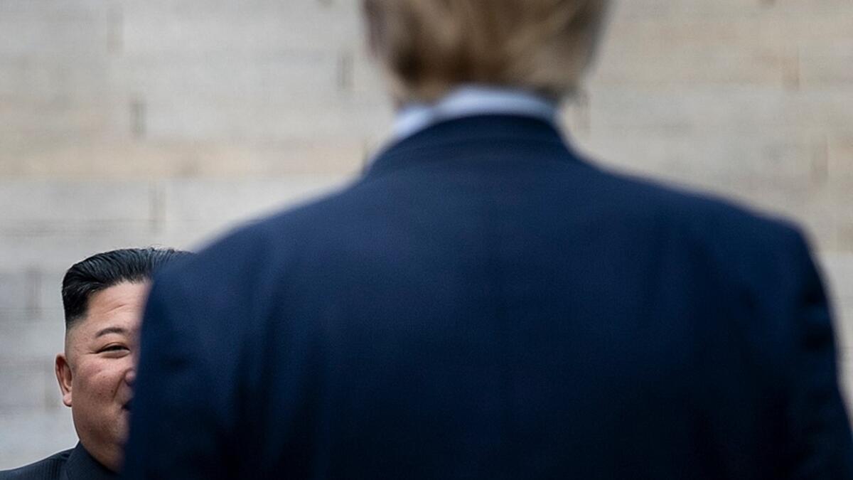 US President Donald Trump waits at the line of demarcation for North Korea's leader Kim Jong-un in the Demilitarized Zone(DMZ) on June 30, 2019, in Panmunjom, Korea.  Brendan Smialowski / AFP