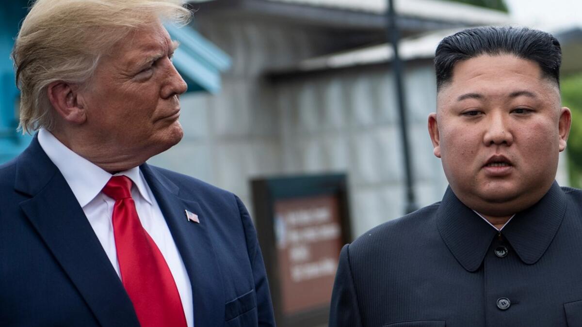 US President Donald Trump and North Korea's leader Kim Jong-un talk before a meeting in the Demilitarized Zone (DMZ) on June 30, 2019, in Panmunjom, Korea.  Brendan Smialowski / AFP