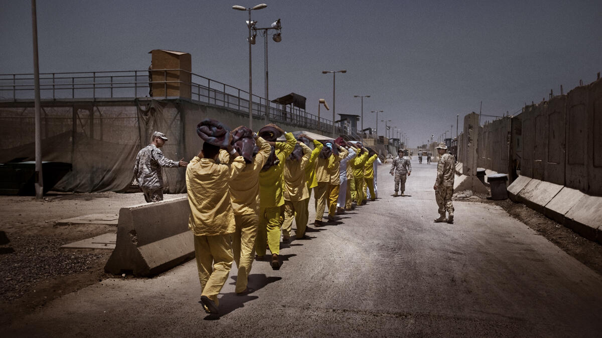 شغل  منصب شرعي عام في تنظيك القاعدة، حتى اعتقلته القوات الأمريكية عام 2003 في سجن بوكا في مدينة البصرة.