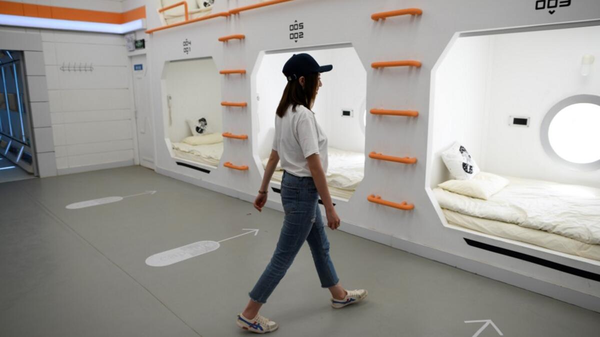 A woman "Mars Base 1", a C-Space Project, in the Gobi desert, some 40 kilometres from Jinchang in China's northwest Gansu province on April 17, 2019. WANG ZHAO / AFP