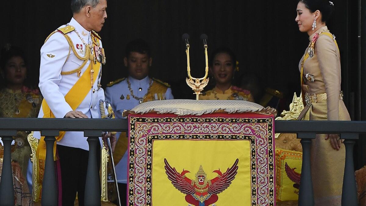 Thailand's King Maha Vajiralongkorn and Queen Suthida appear on the balcony of Suddhaisavarya Prasad Hall of the Grand Palace as they grant a public audience on the final day of his royal coronation in Bangkok on May 6, 2019.  Jewel SAMAD / AFP